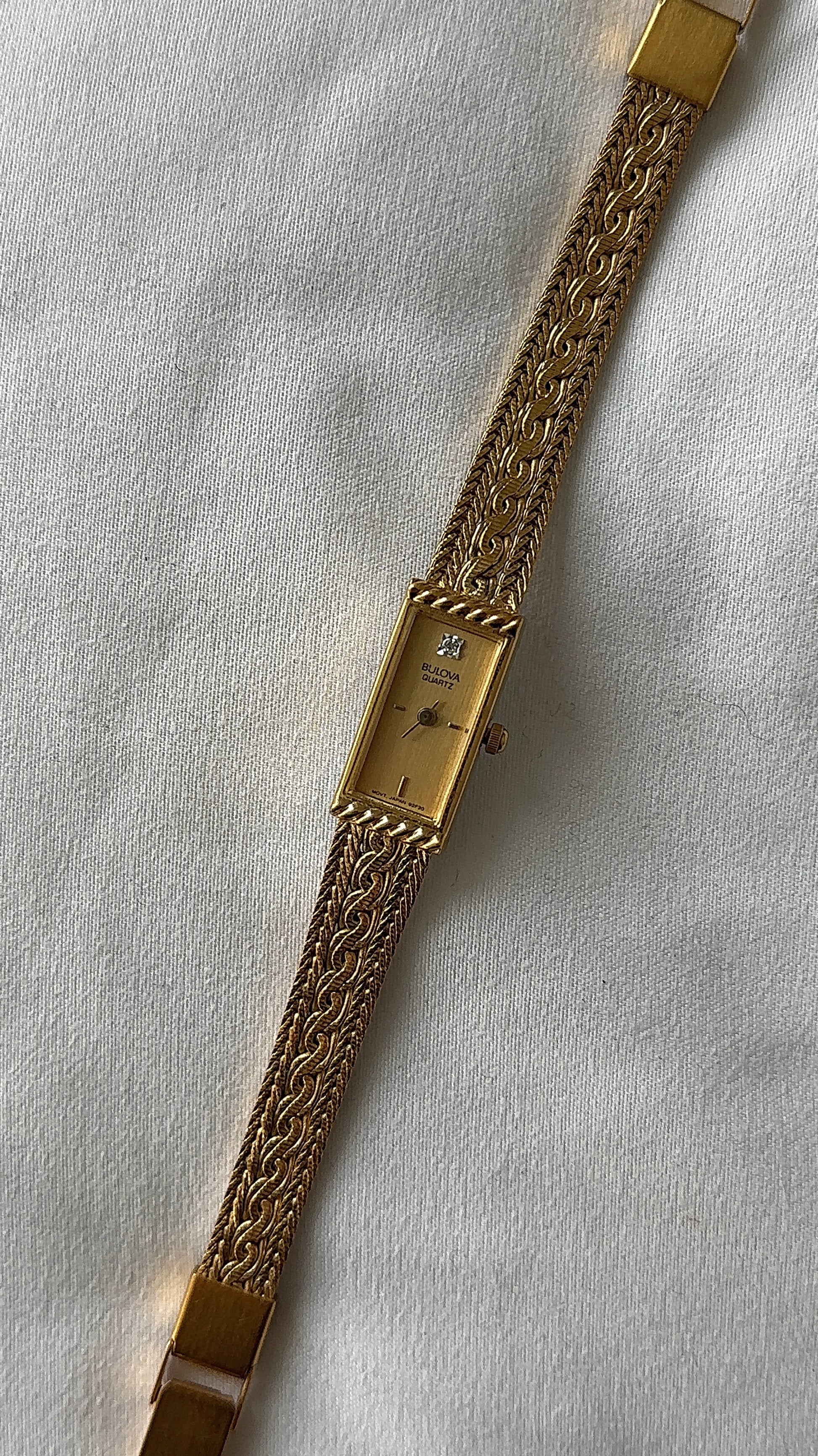 Working dainty gold-tone braided band watch